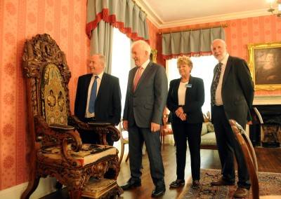 Minister of State at the Department of Transport, Tourism and Sport Michael Ring and Minister Jimmy Deenihan, John McMahon, OPW and Charlotte Hayden, guide pictured beside Daniel O'Connell, The Liberator's Chair in Derrynane House.